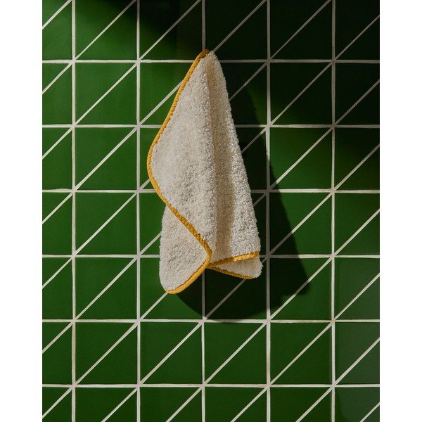 Žuti /bijeli pamučan ručnik od frotira 30x50 cm Sedora – Kave Home-image-1