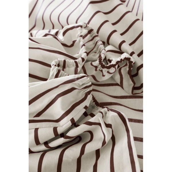 Krem/tamno smeđa plahta s gumom od organskog pamuka 90x200 cm Sima – Jotex
